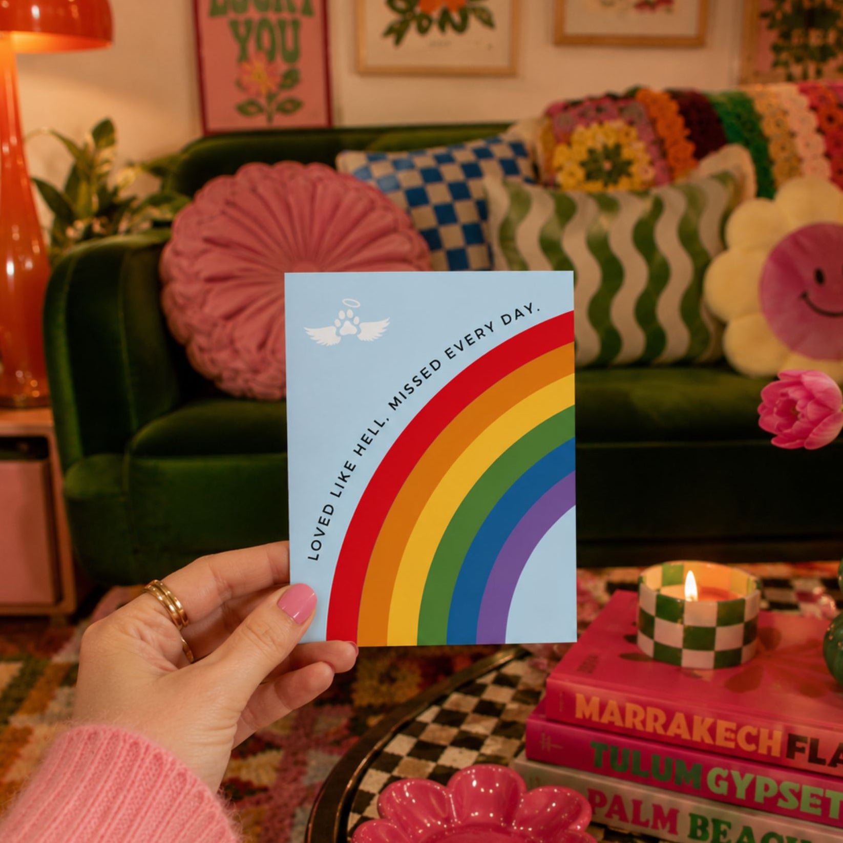 Pet loss sympathy card with a rainbow bridge design that reads 'loved like hell, missed every day.'