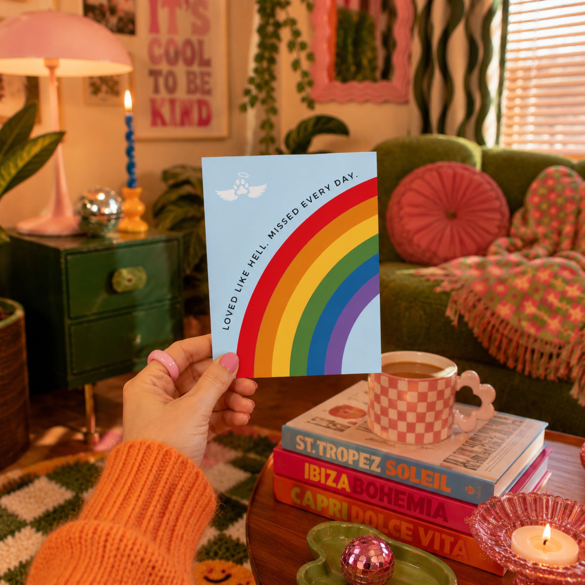Pet loss sympathy card with a rainbow bridge design that reads 'loved like hell, missed every day.'